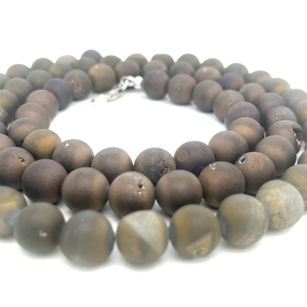 A Unisex Druzy Agate Necklace styled for layering and everyday wear, on a white background, center-spiral overview. 