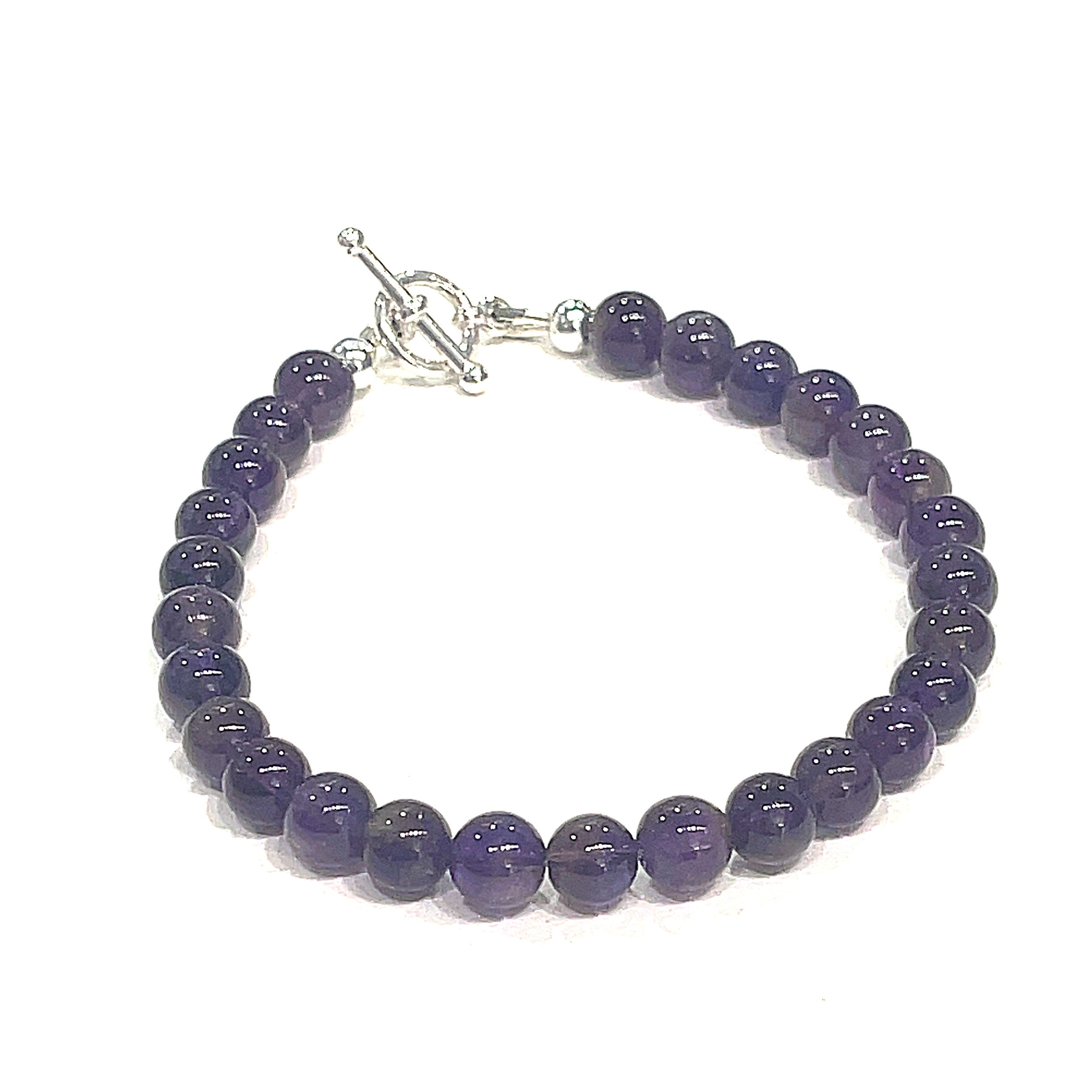 A beaded Amethyst gemstone bracelets, displayed against a white background, front close up overview. 