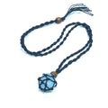 A black macramé necklace cord with a blue gemstone cage pendant on a white background, center overview. 