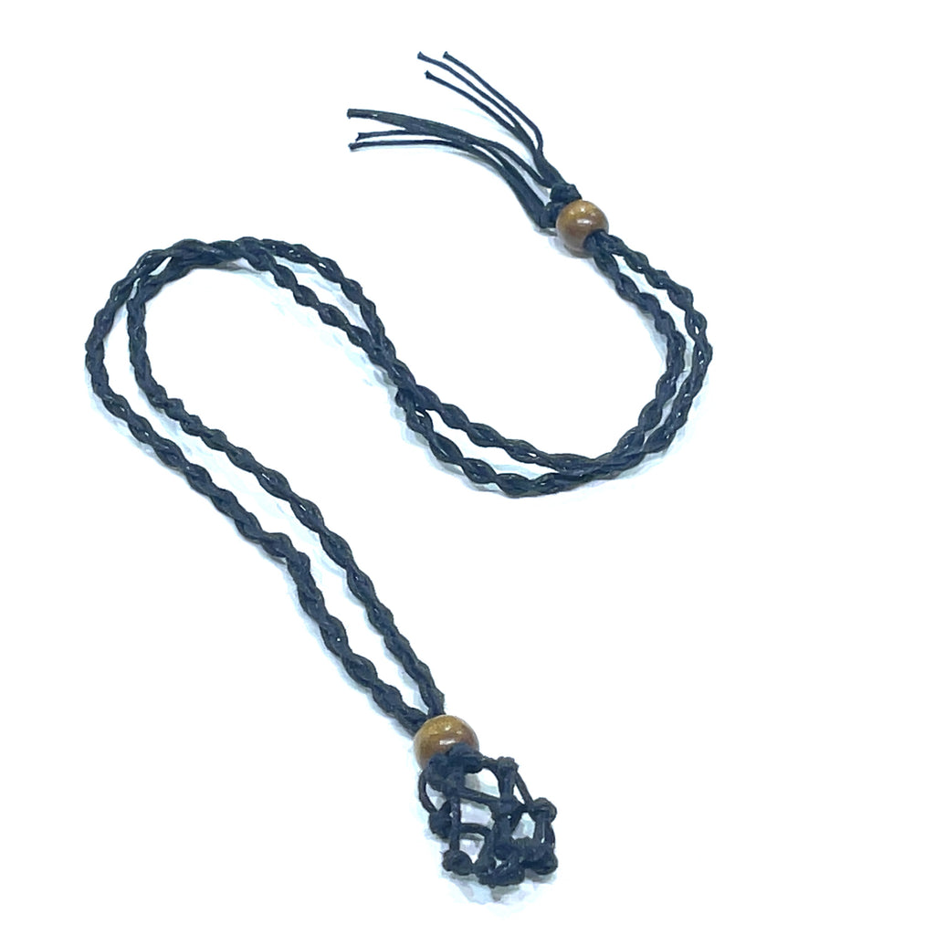 A black macramé necklace cord with out a gemstone cage pendant on a white background, center overview. 
