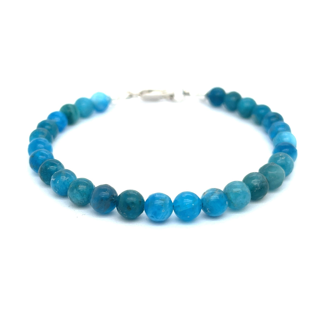 A blue Apatite beaded gemstone bracelet with silver lobster claws, displayed against a white background, front overview.