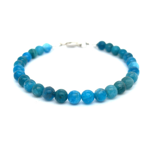 A blue Apatite beaded gemstone bracelet with silver lobster claws, displayed against a white background, front overview.