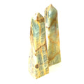 A collection of 3XL large sizes of  blue onyx gemstone towers displayed in a group on a white background, front overview.
