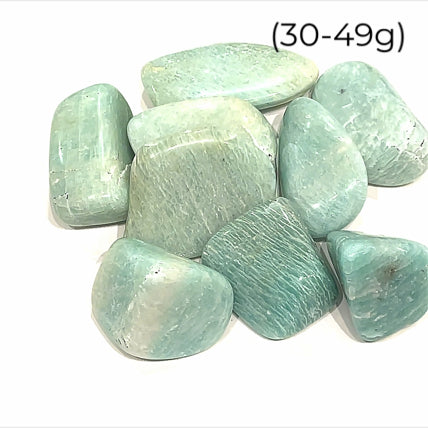 A collection of Amazonite gemstone tumbles (30-49g), front close up overview.  