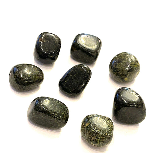 A collection of Asterite gemstone tumbles displayed on a white background, front overview.