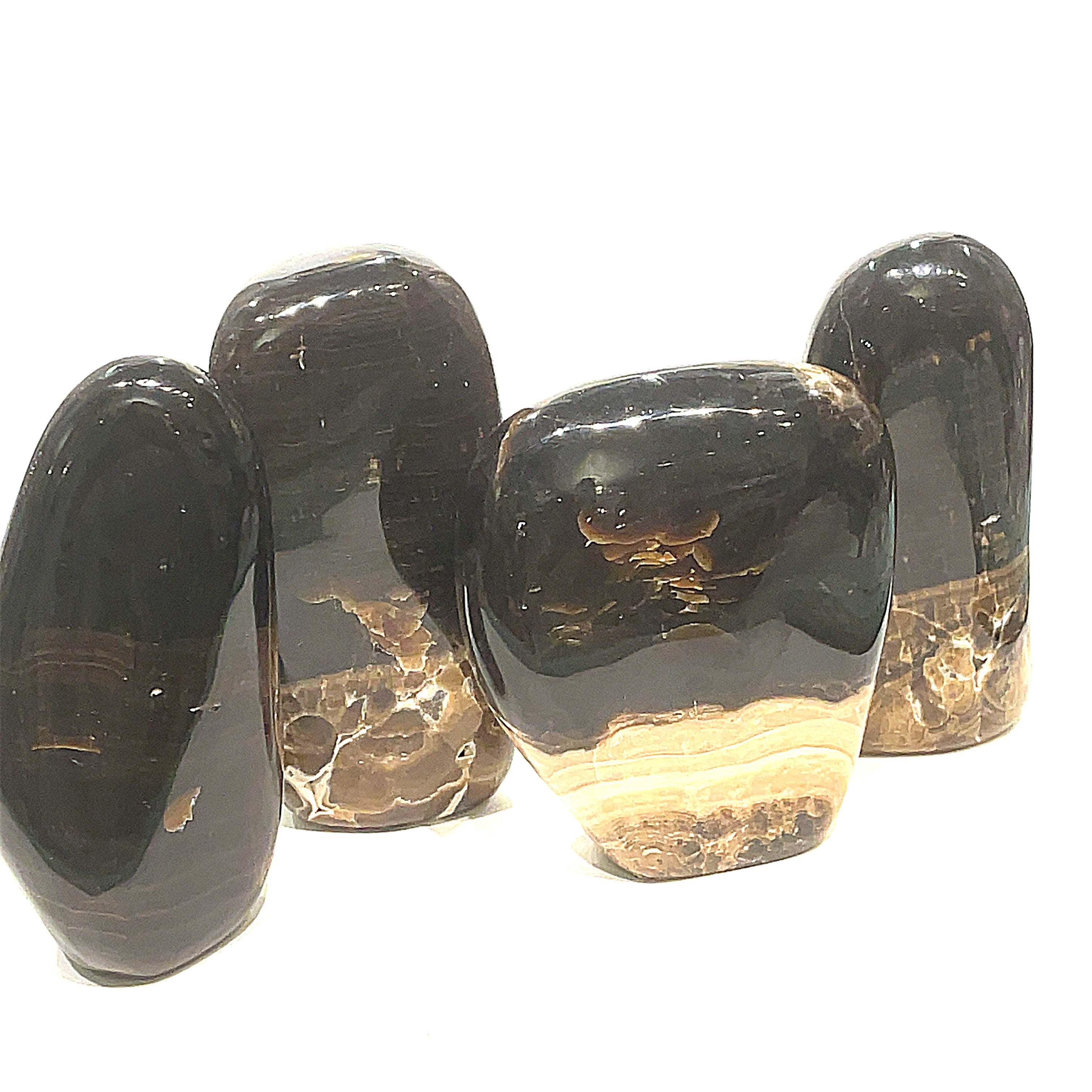 A collection of Chocolate Calcite free-form gemstones varying slightly in size and shape, with a smooth, polished finish. They are displayed against a white background in a front view. 