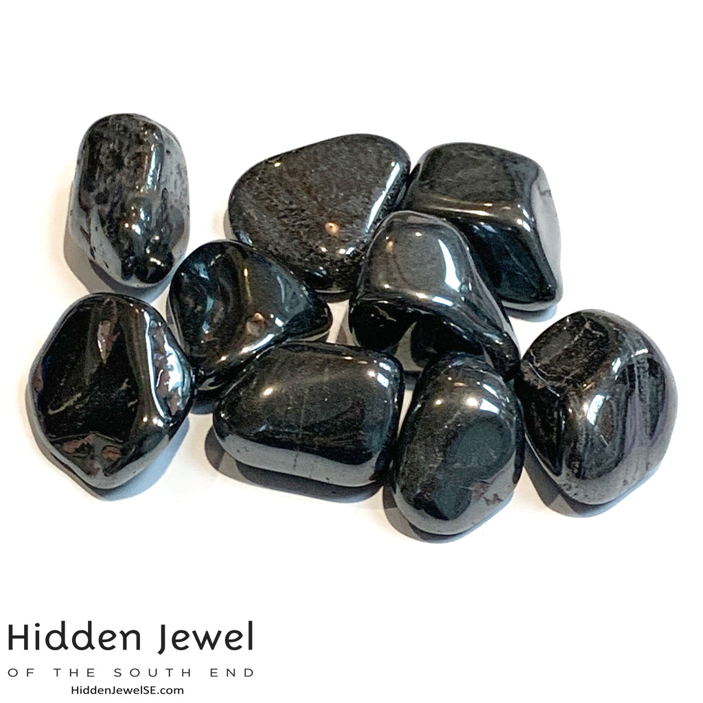 A collection of Hematite gemstones on a white background, front view. 