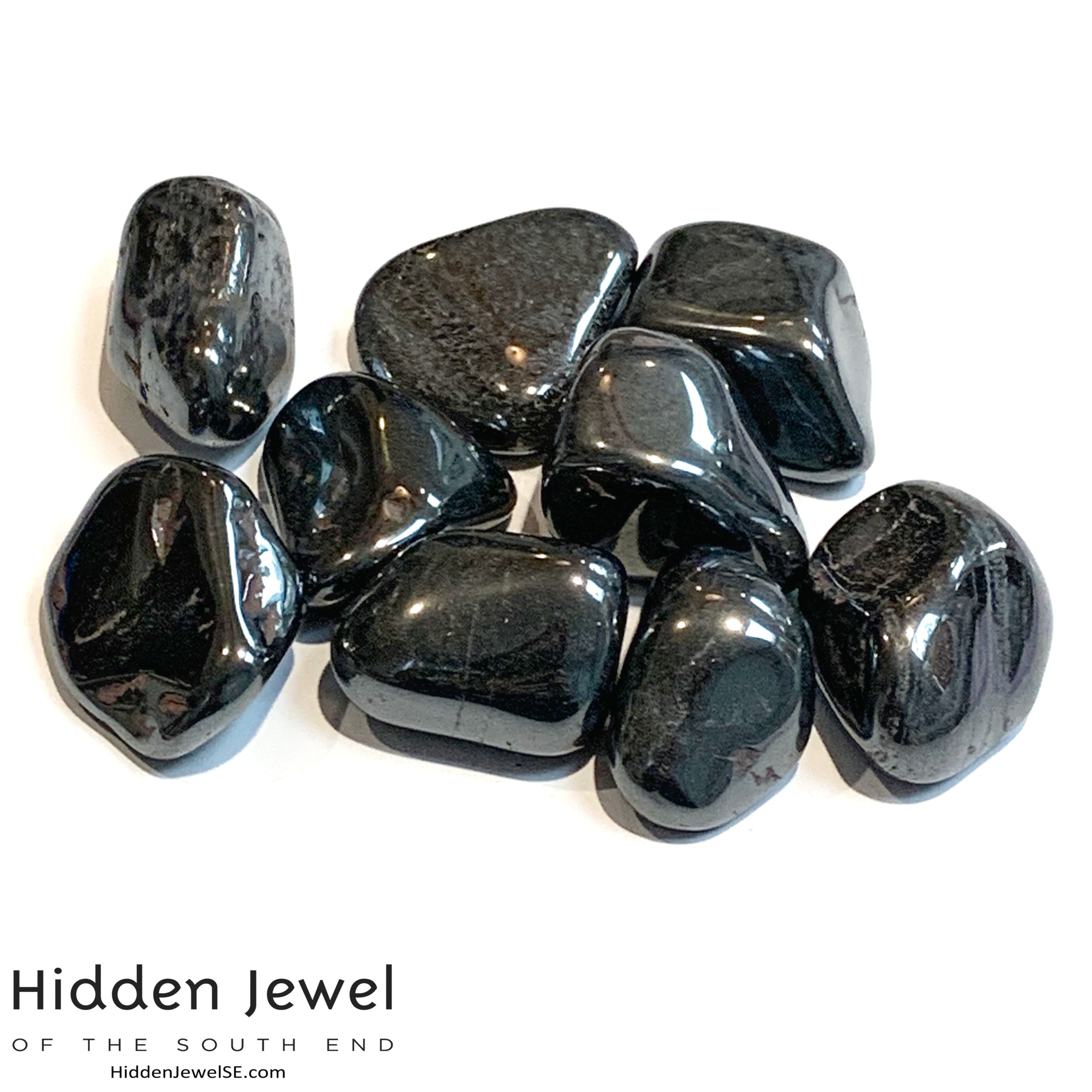 A collection of Hematite gemstones on a white background, front view. 
