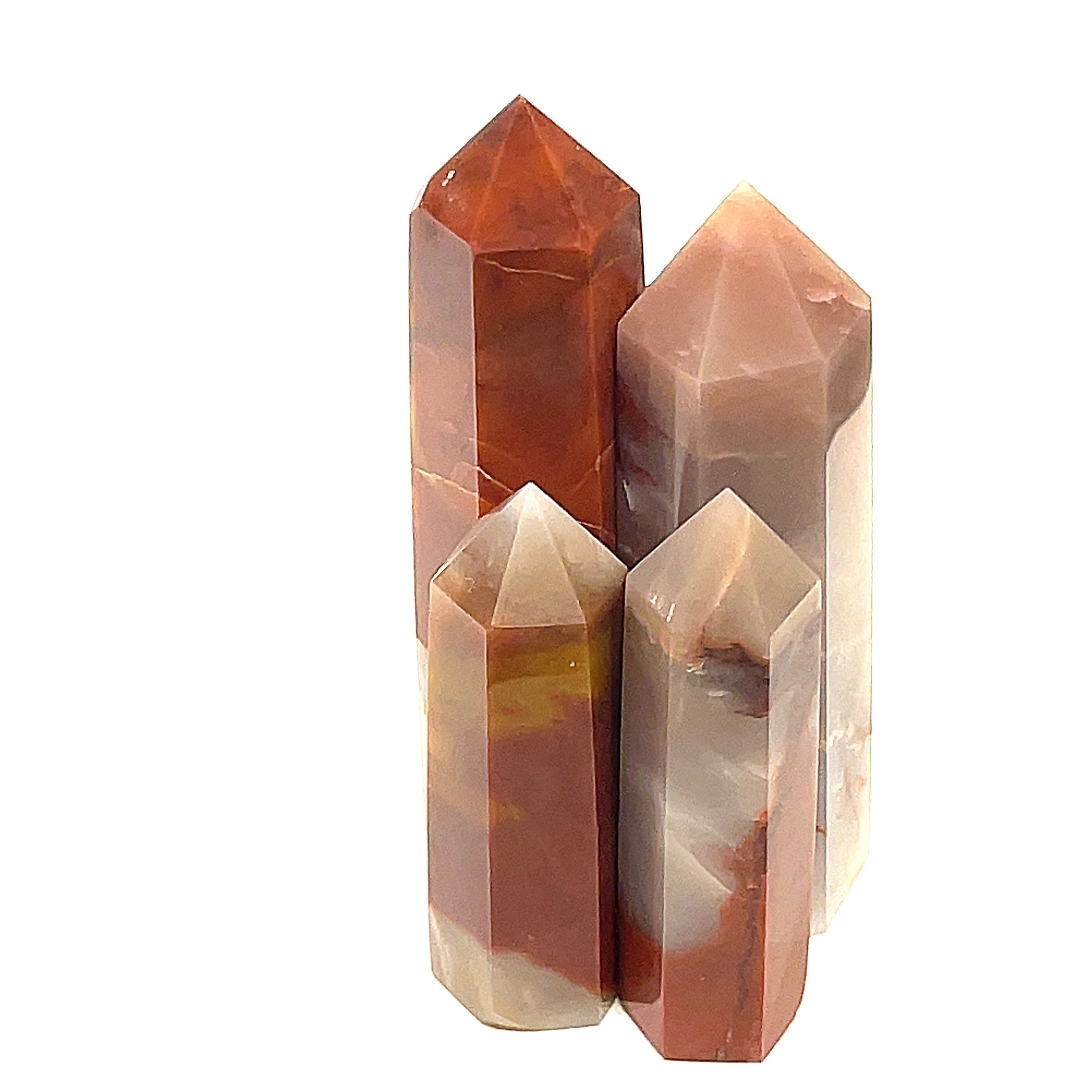 A collection of Red Jasper gemstone towers of varying sizes, arranged vertically, displaying their polished, rectangular faceted shapes and translucent red coloring on a white background front view.