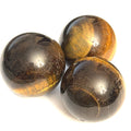 A collection of golden tiger eye gemstone spheres, displayed on a white background in a triangular, front view.