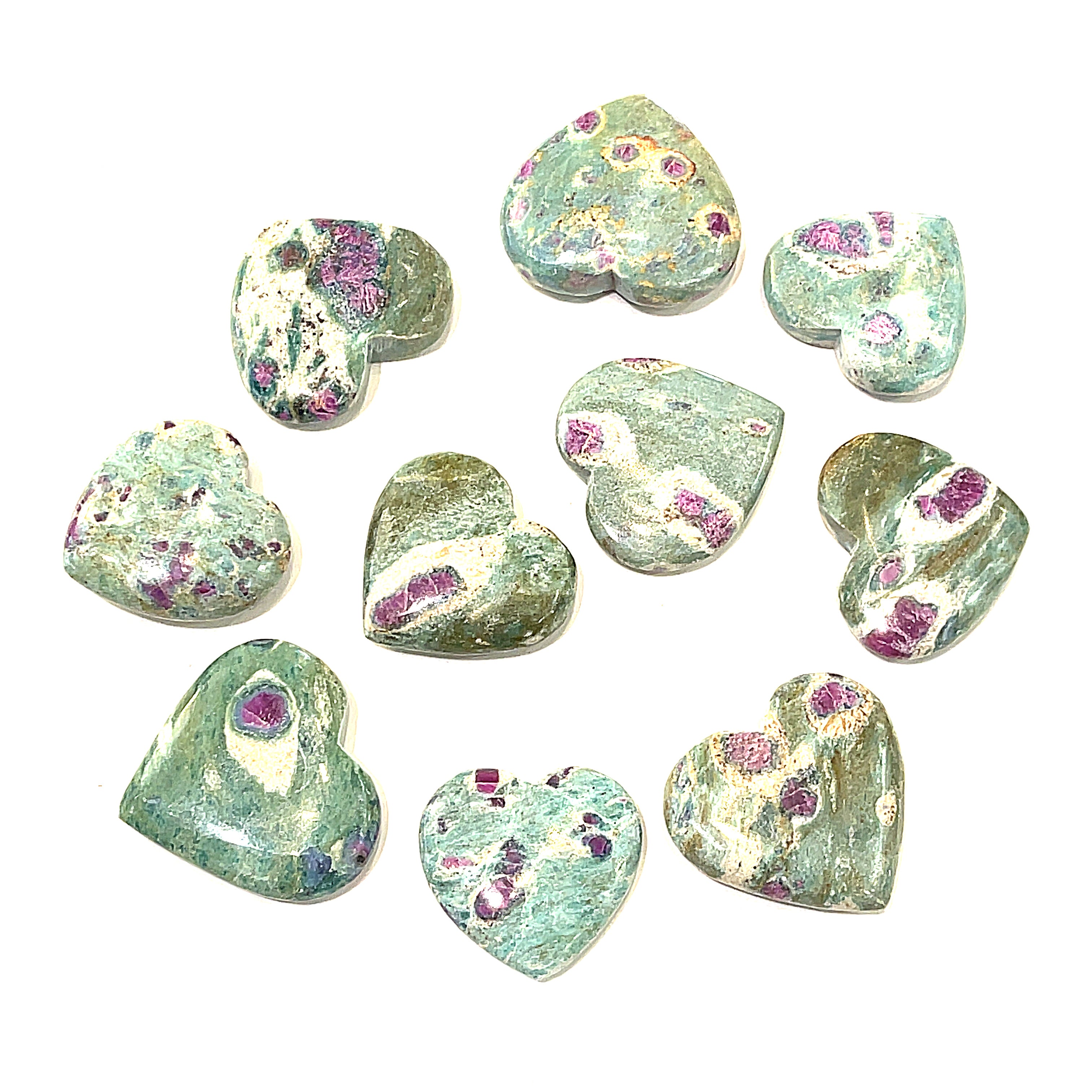 A collection of heart-shaped Ruby Fuchsite gemstone carvings displayed on a white background front overview.