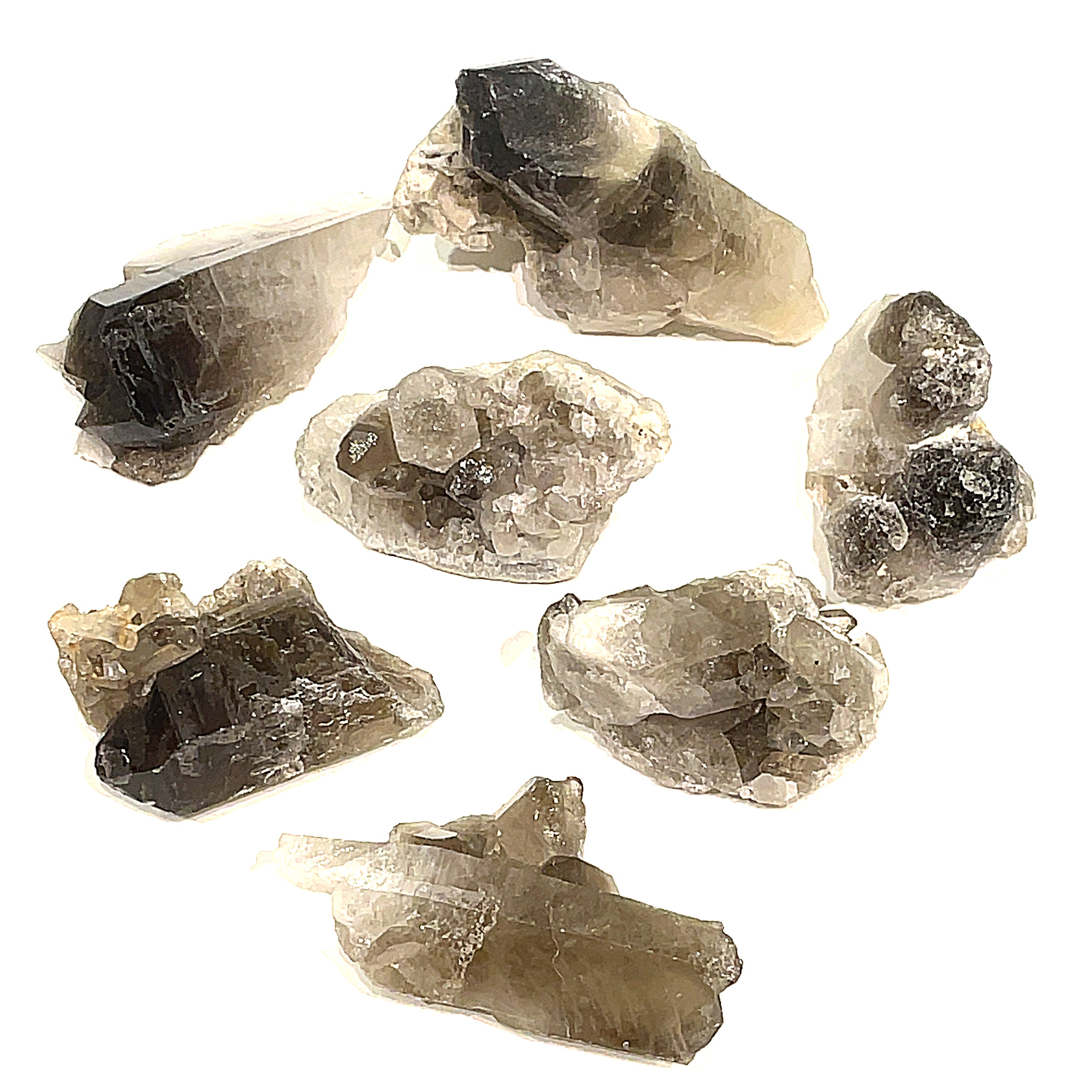 A collection of large Smokey Quartz gemstone clusters displayed on a white background, front, close-up overview.