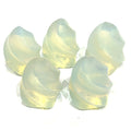 A collection of mini opalite gemstone flames displayed on a white surface, front overview. 