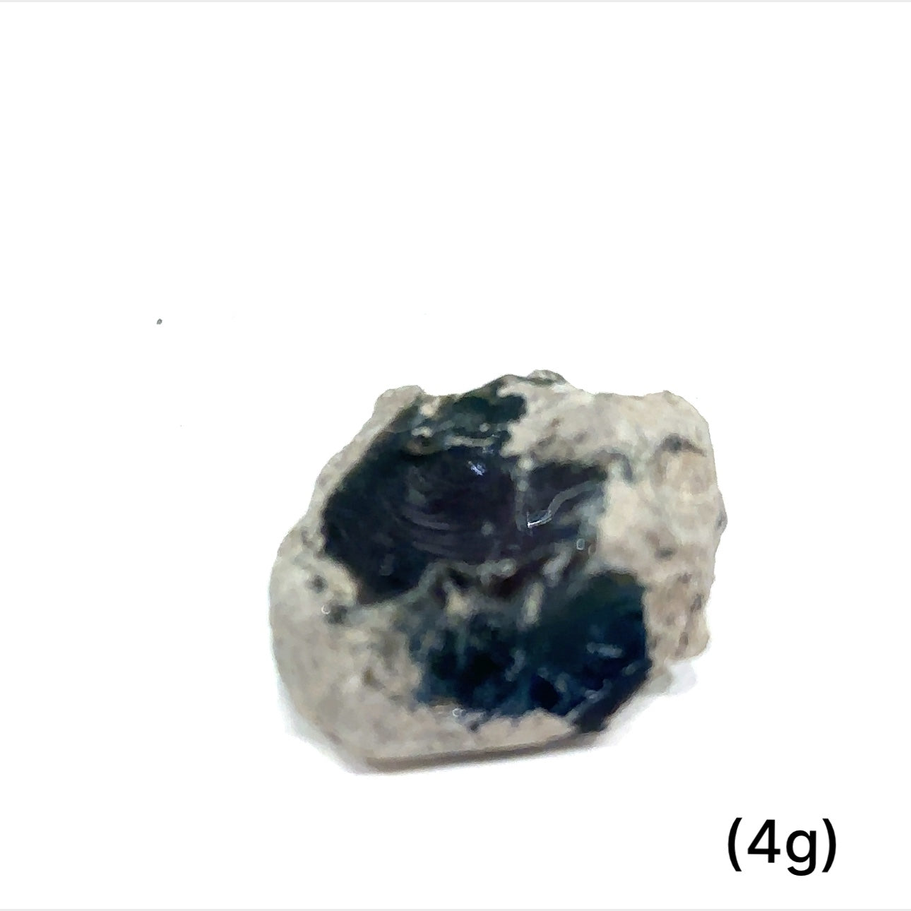 A collection of raw Black Ethiopian opal gemstones with varying colors, displayed on a white background, 4g.
