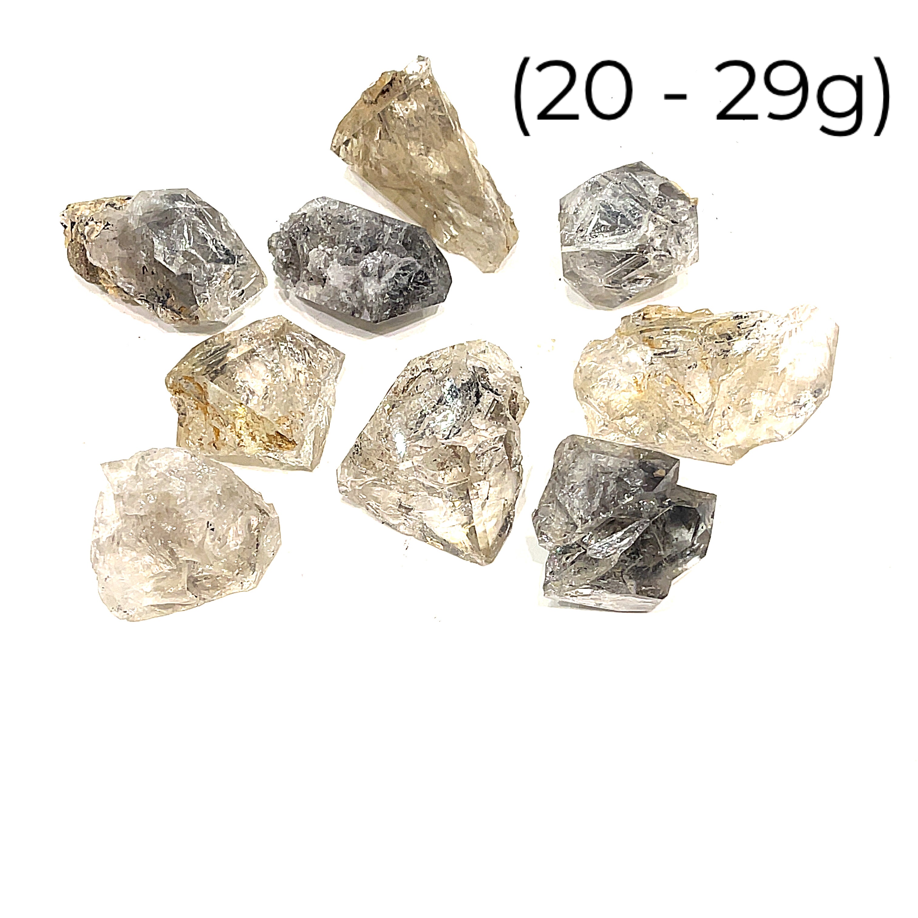 A collection of raw Herkimer diamond gemstones (20-29g) displayed on a white background, front, overview. 