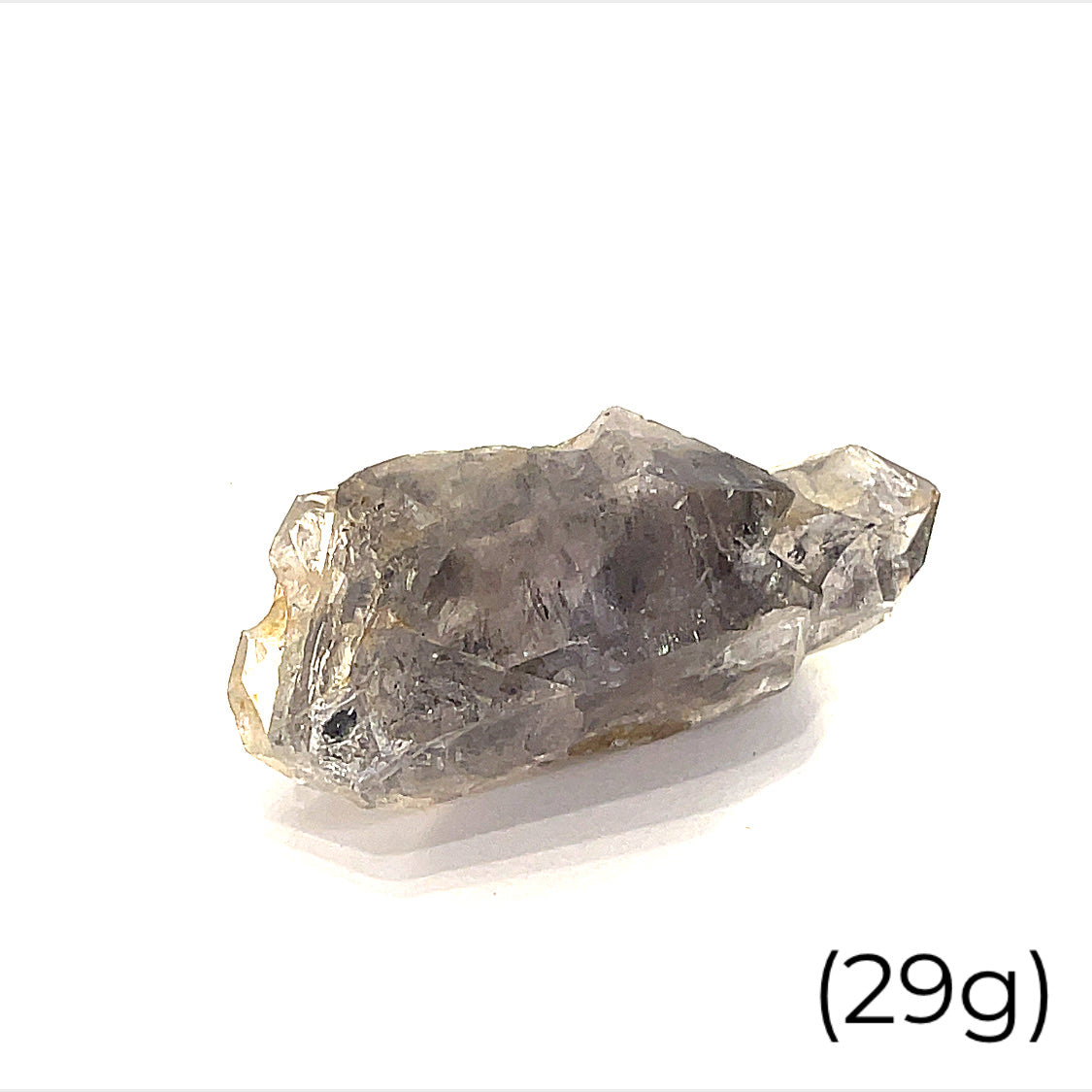 A collection of raw Herkimer diamond gemstones (29g) displayed on a white background, front, overview. 
