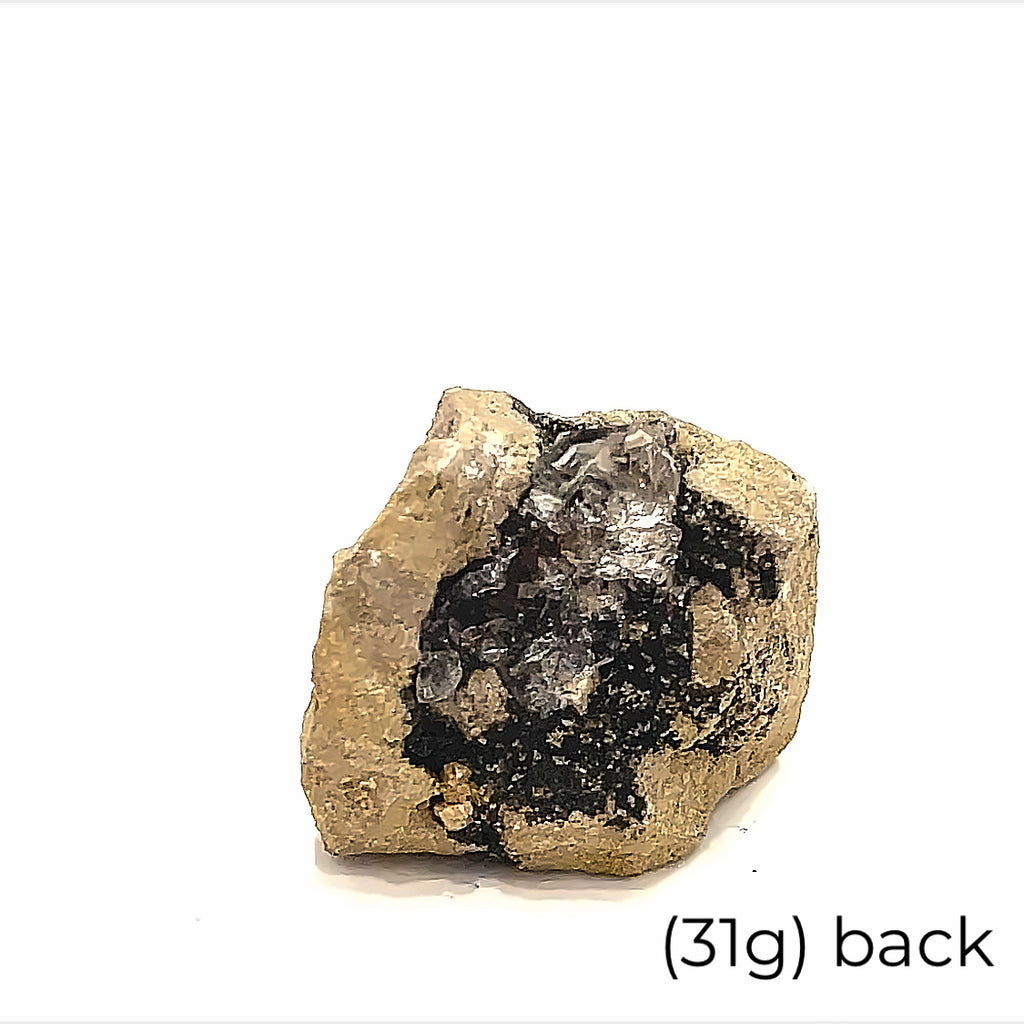 A collection of raw Herkimer diamond gemstones (31g back) displayed on a white background, back, overview. 
