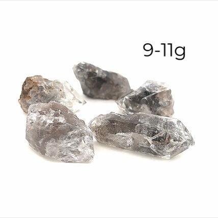 A collection of raw Herkimer diamond gemstones (9-11g) displayed on a white background, front, overview. 