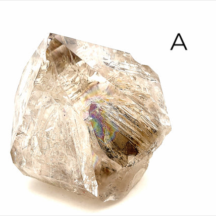 A collection of raw Herkimer diamond gemstones (A) displayed on a white background, front,  close up overview. 