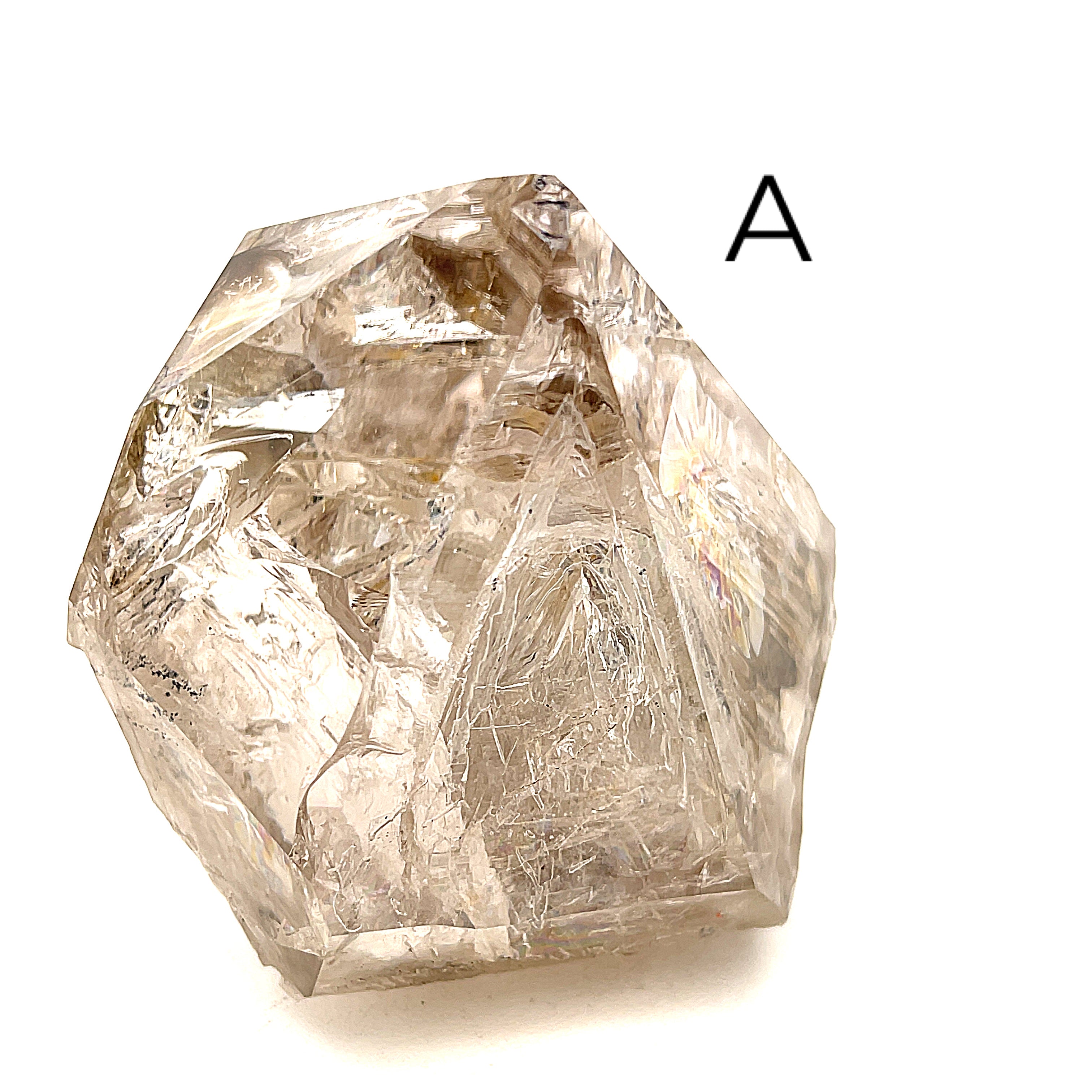 A collection of raw Herkimer diamond gemstones (A) displayed on a white background, front, overview. 
