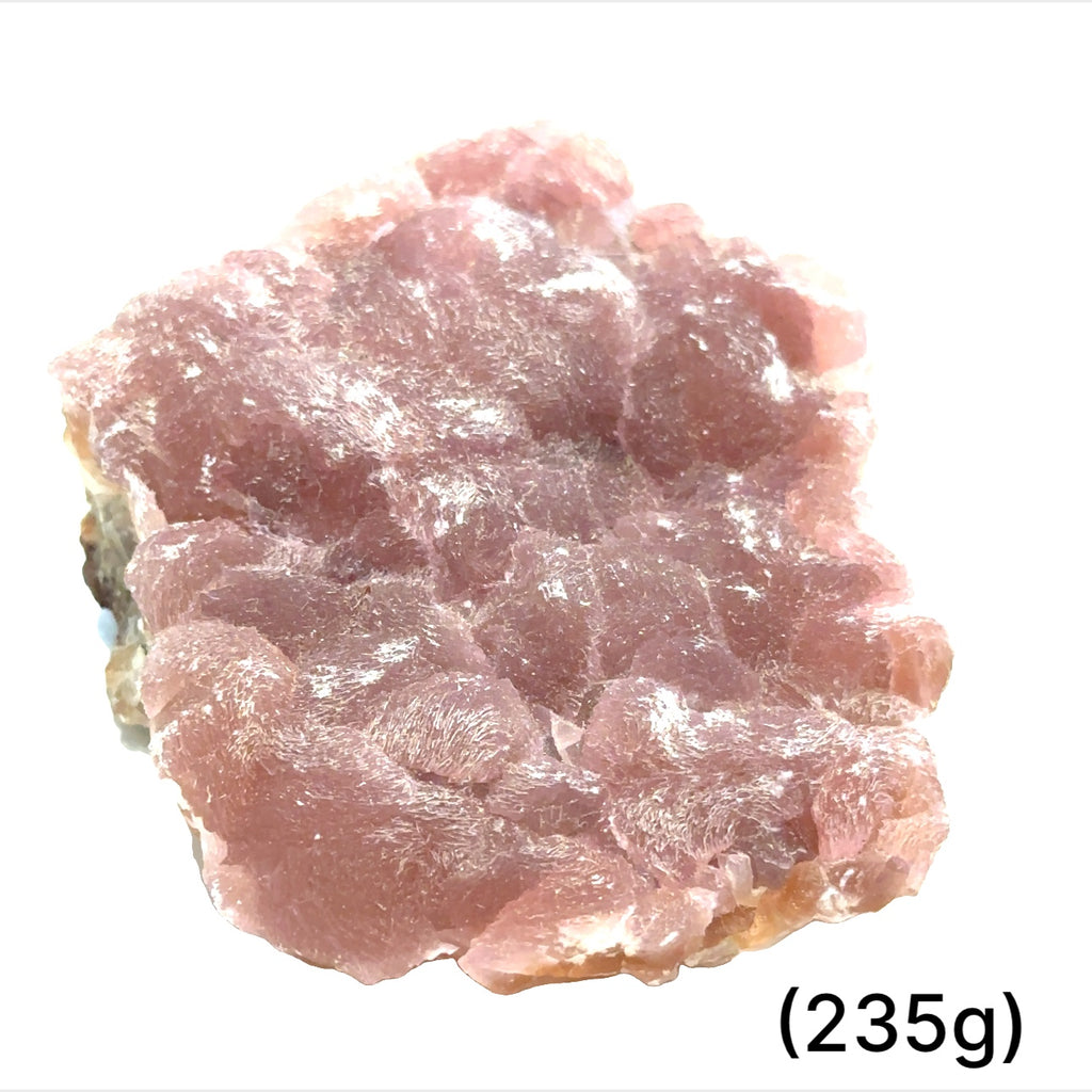 A collection of raw cobalt calcite gemstones with a pinkish hue, showing a rough, unpolished texture, and varying in size. The text indicates the weight range of 235 grams. on white background, front view