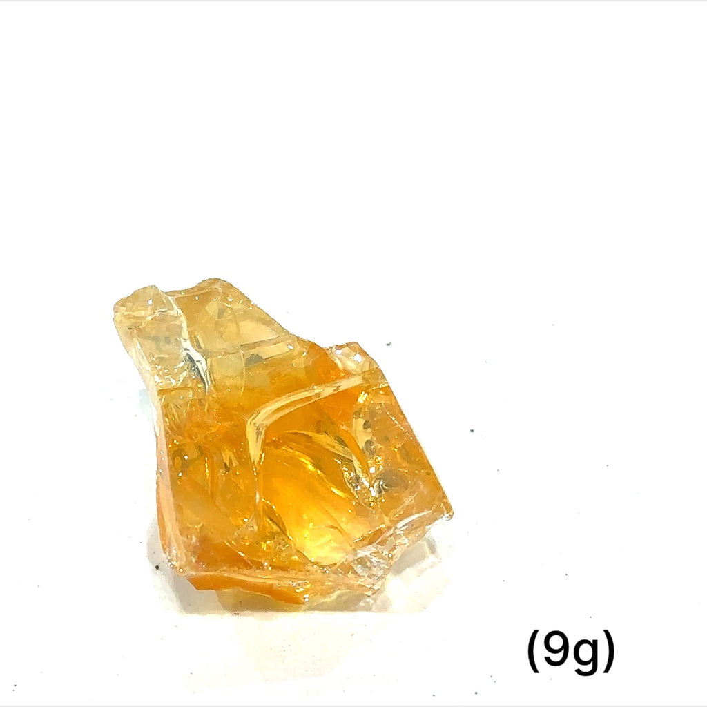 A collection of raw fire Ethiopian opal gemstones with varying colors, displayed on a white background, 9g.