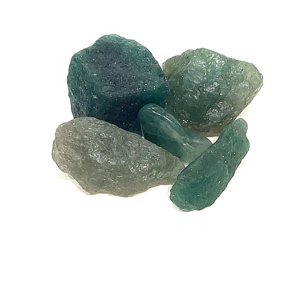 A collection of raw green tanzurine gemstones against a white background, front overview. 