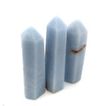 A collection of three Angelite gemstone towers displayed together on a white background front, center, close up  overview. 