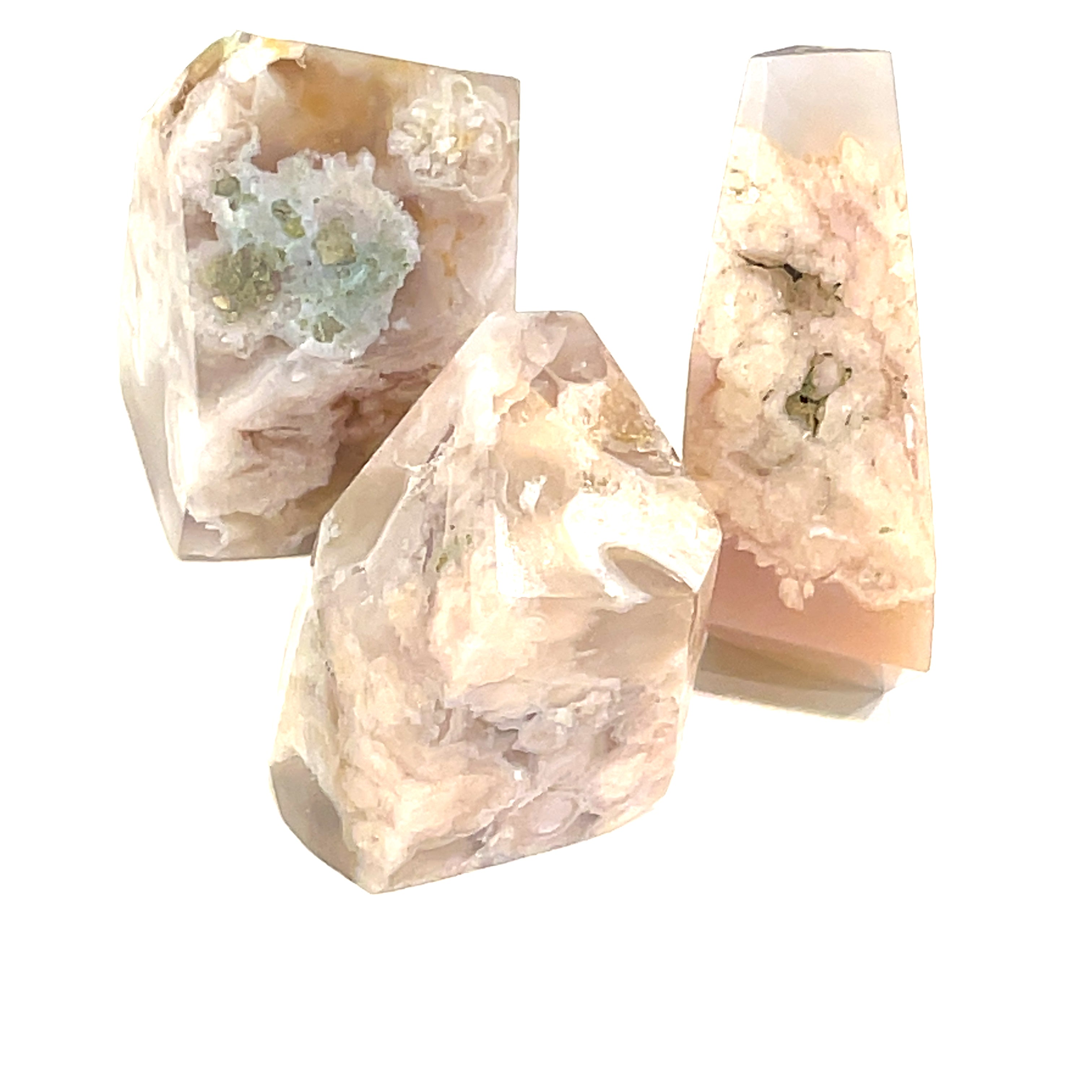 A collection of three free-form Flower Agate gemstones with varying shades of brown, green, and white patterns, and on a white background, front overview.