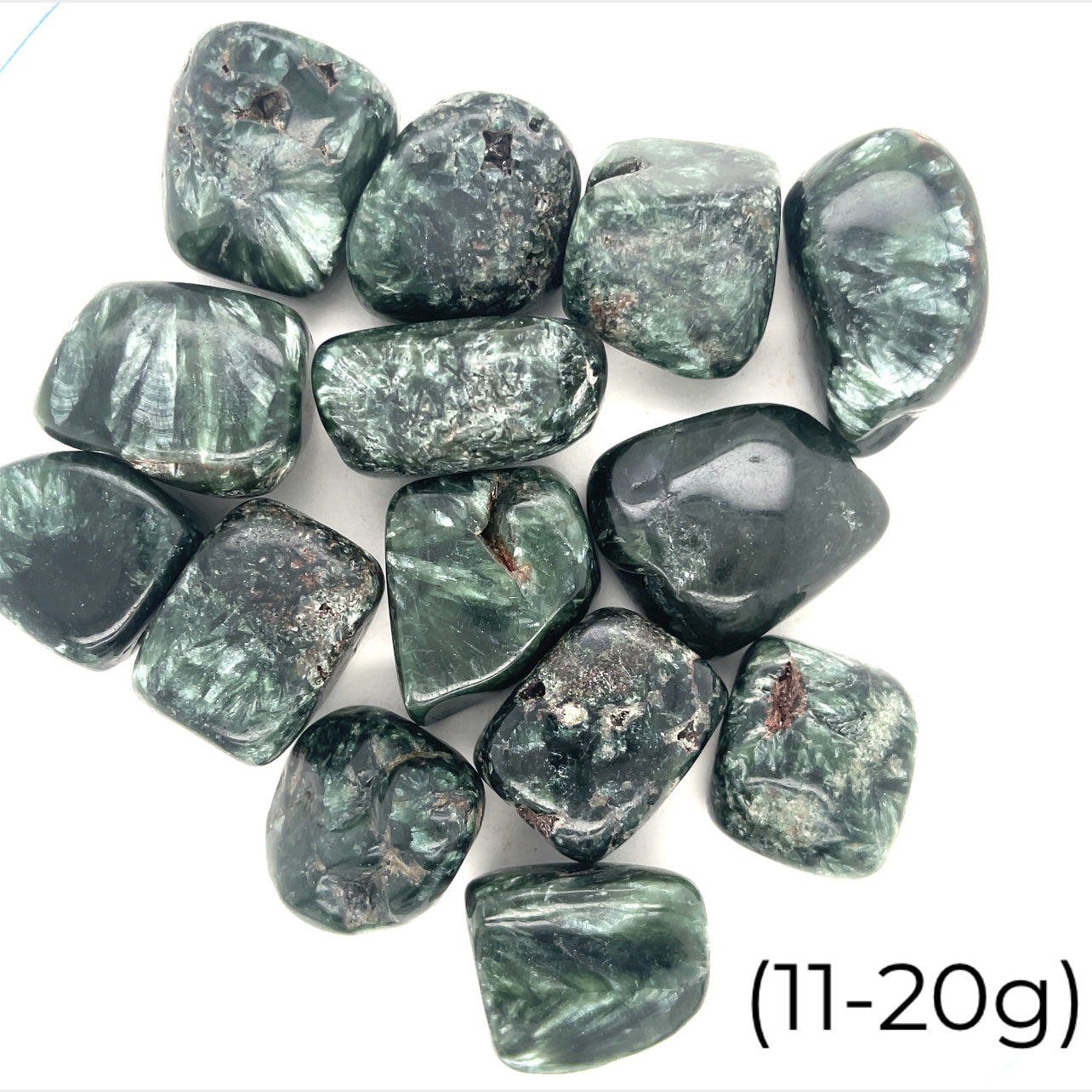 A collection of tumbled Seraphinite gemstones with a range of green hues and unique white markings on a white background, front view. size (11-20g)