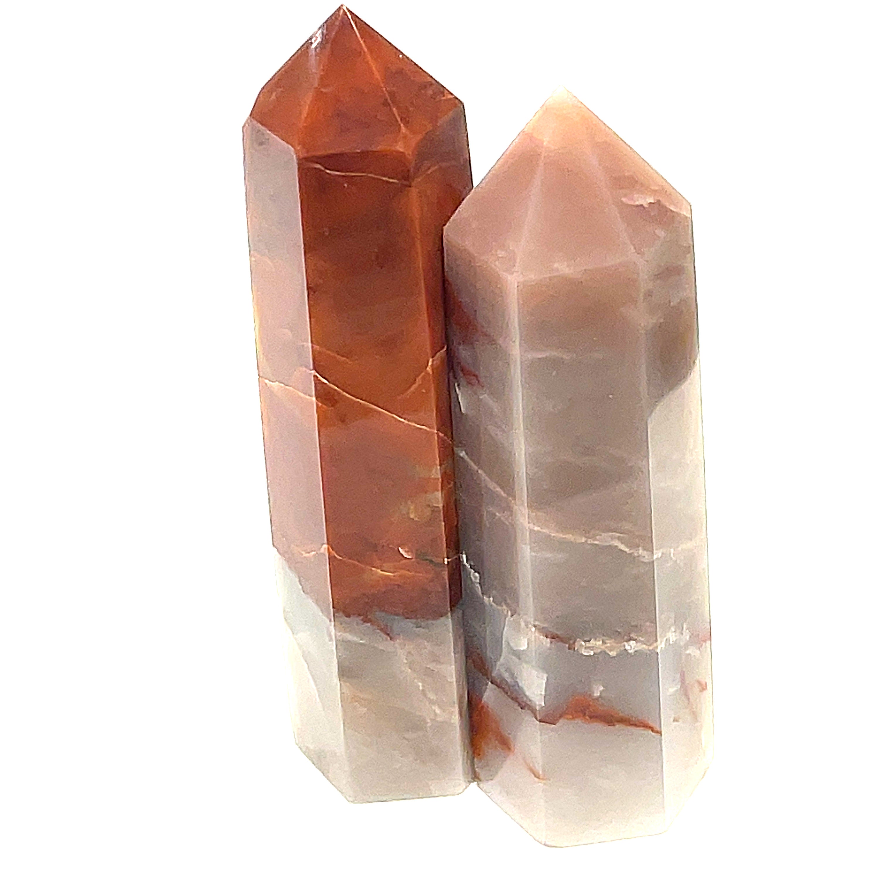 A collection of two Red Jasper gemstone towers of varying sizes, arranged vertically, displaying their polished, rectangular faceted shapes and translucent red coloring on a white background front view.