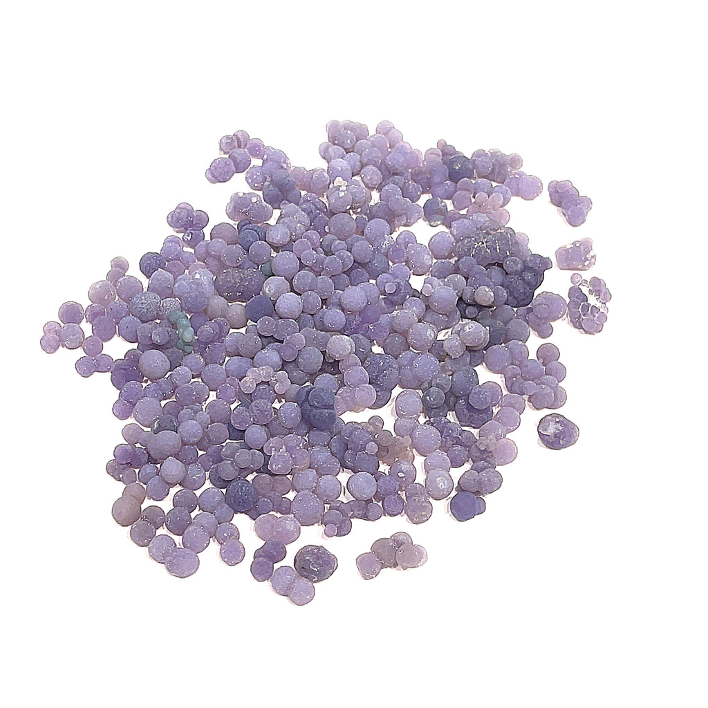 A collection of xs grape agate gemstone on a white background, front overview. 