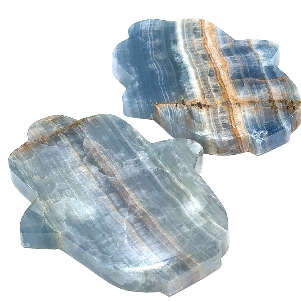 A different Two Blue Onyx gemstone carvings in a Hamsa shape with visible blue and white color patterns on a white background front overview