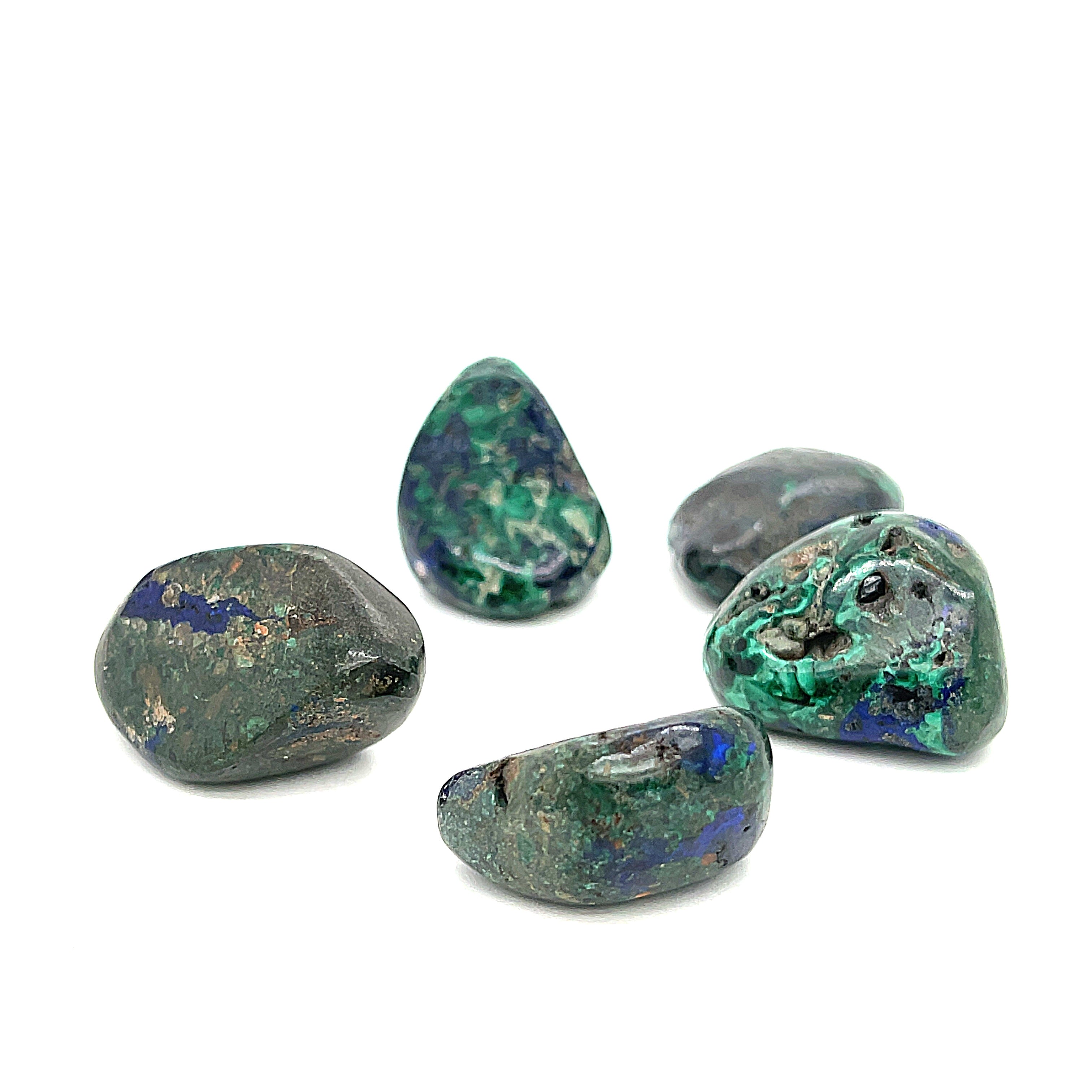 A few tumbled Azurite gemstone with visible Malachite inclusions on a white background, front view.