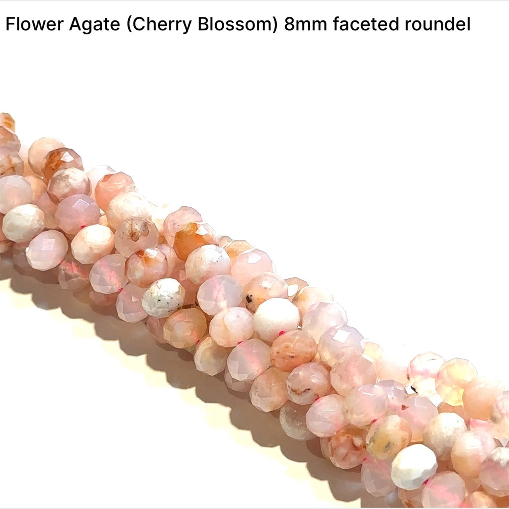 A flower agate gemstone strand, 8mm faceted roundel, on a white background, front overview. 