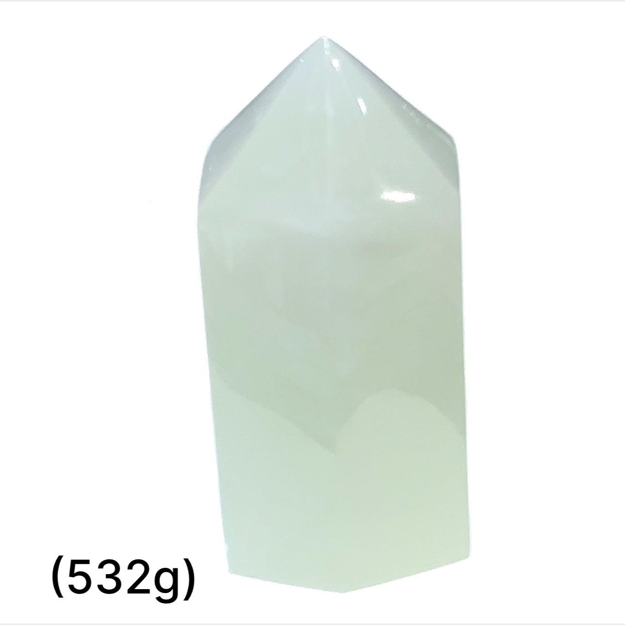 A green calcite gemstone tower (532g) on a white background, front overview.
