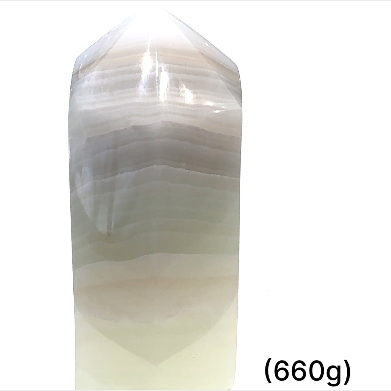 A green calcite gemstone tower (660g) on a white background, front overview.