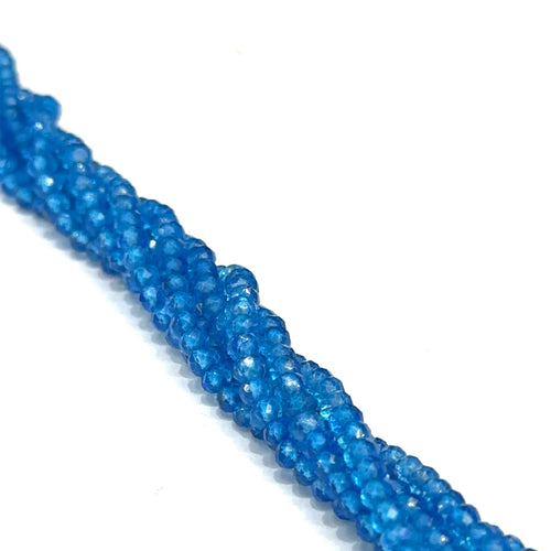  A group of 3.5mm Swiss Blue Topaz faceted  round gemstone strand. on a white background front overview. 