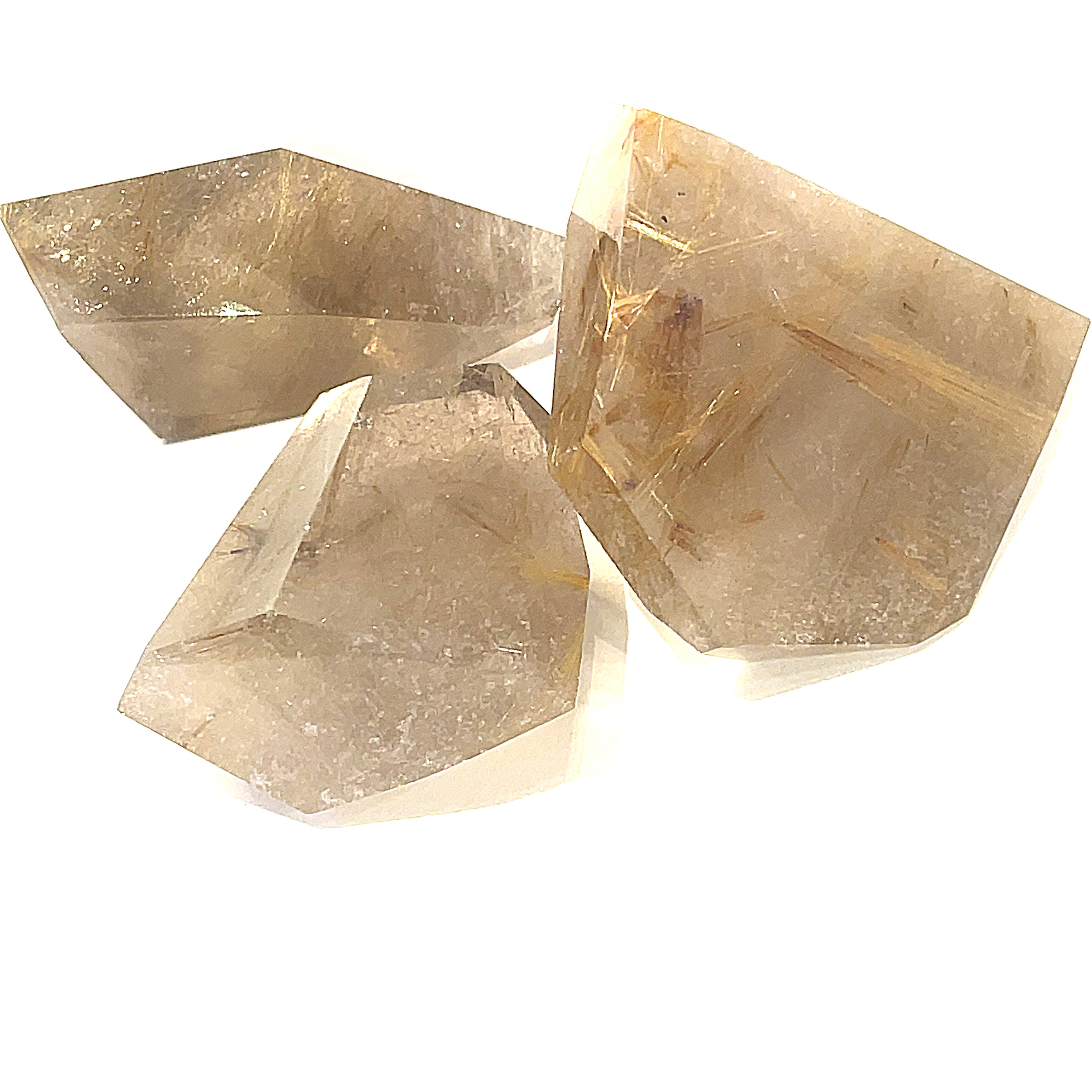  A group of  free-form Rutilated Quartz gemstone on a white background, front overview.
