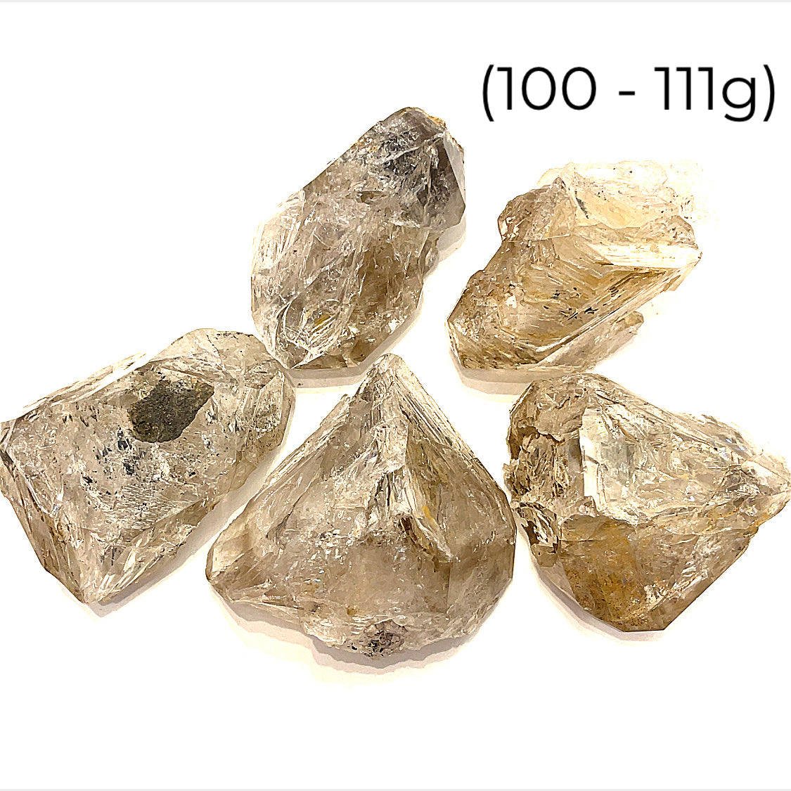 A  group of raw Herkimer diamond gemstone (100-111g) displayed on a white background, front, overview.