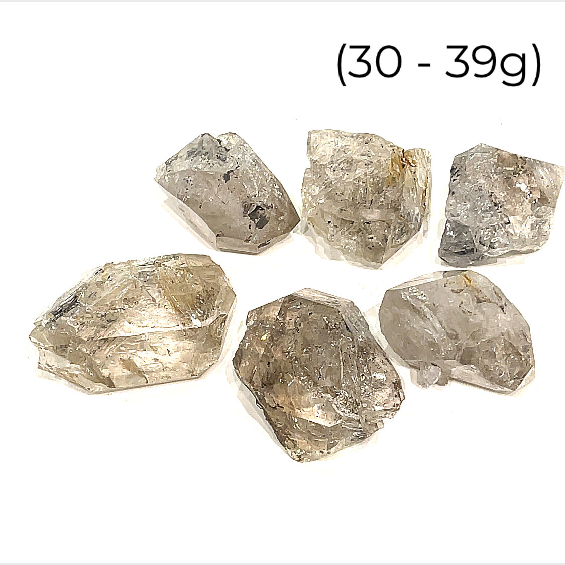 A group of raw Herkimer diamond gemstone (30-39g) displayed on a white background, front, overview. 