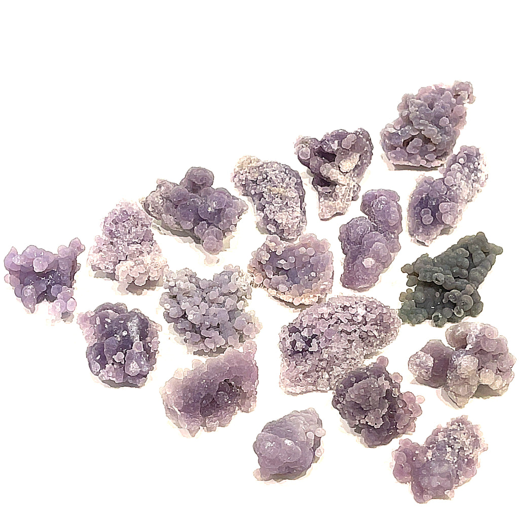 A group of small grape agate gemstone  on a white background, front close up overview. 