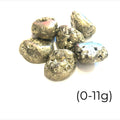 A group of tumbled Pyrite gemstones with a label indicating their weight range of 0-11 grams on a white background, front overview. 