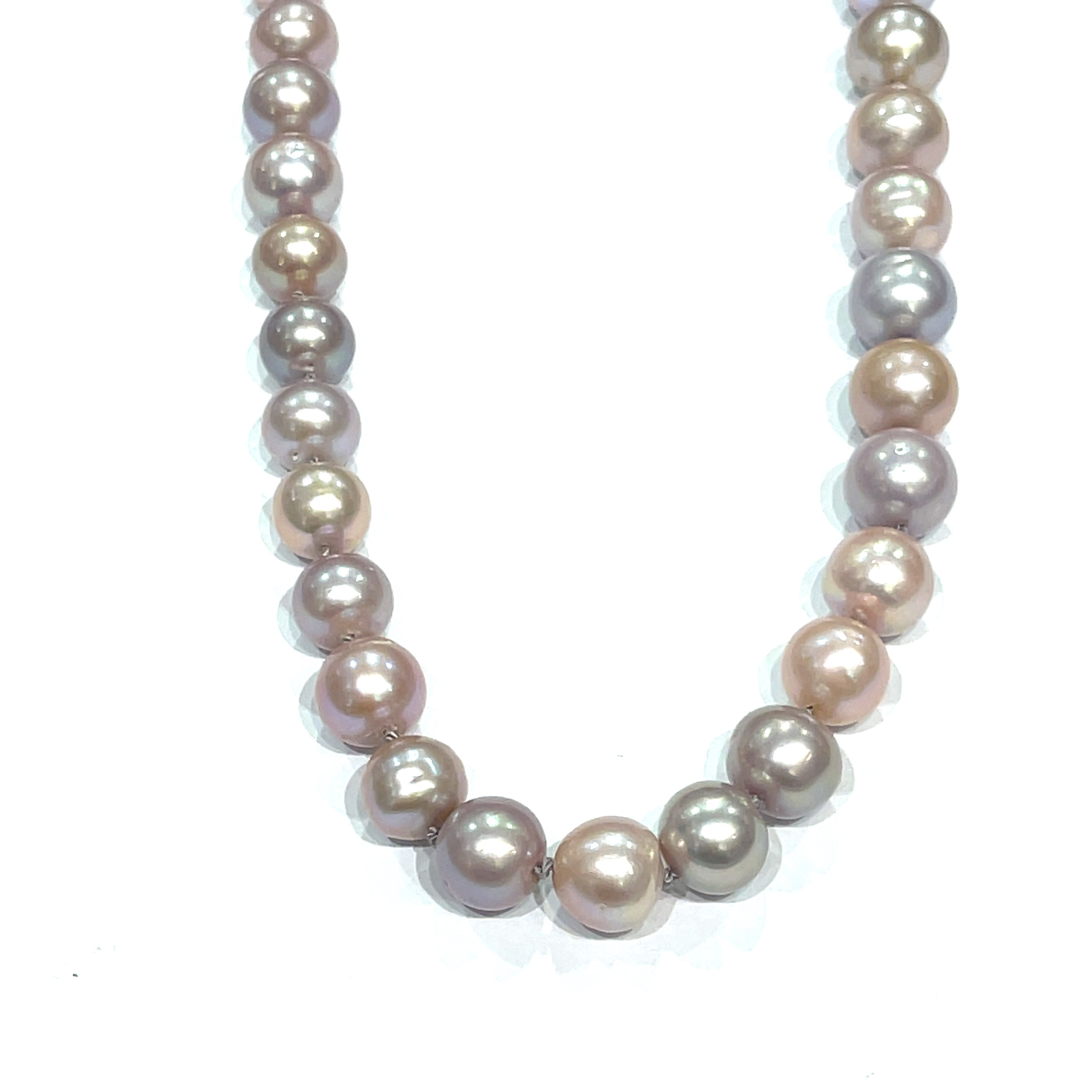 A knotted necklace featuring Edison pearls in varying shades of silver and gold, with a sterling silver box clasp and a bezel set labradorite gemstone. On a white background, hanging front overview.