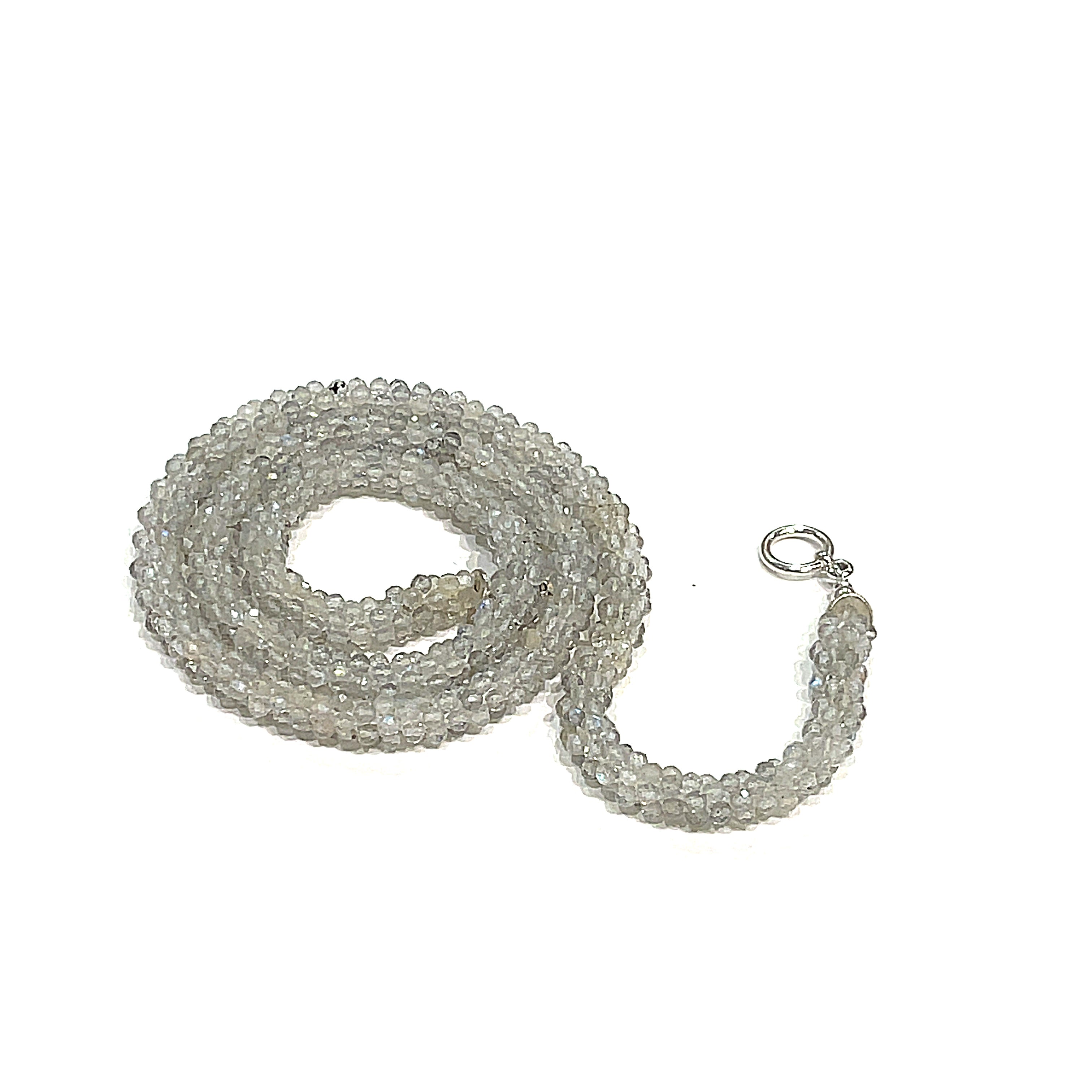 A labradorite gemstone crocheted necklace with a sterling silver toggle. Displayed on a white background, center spiral overview. 
