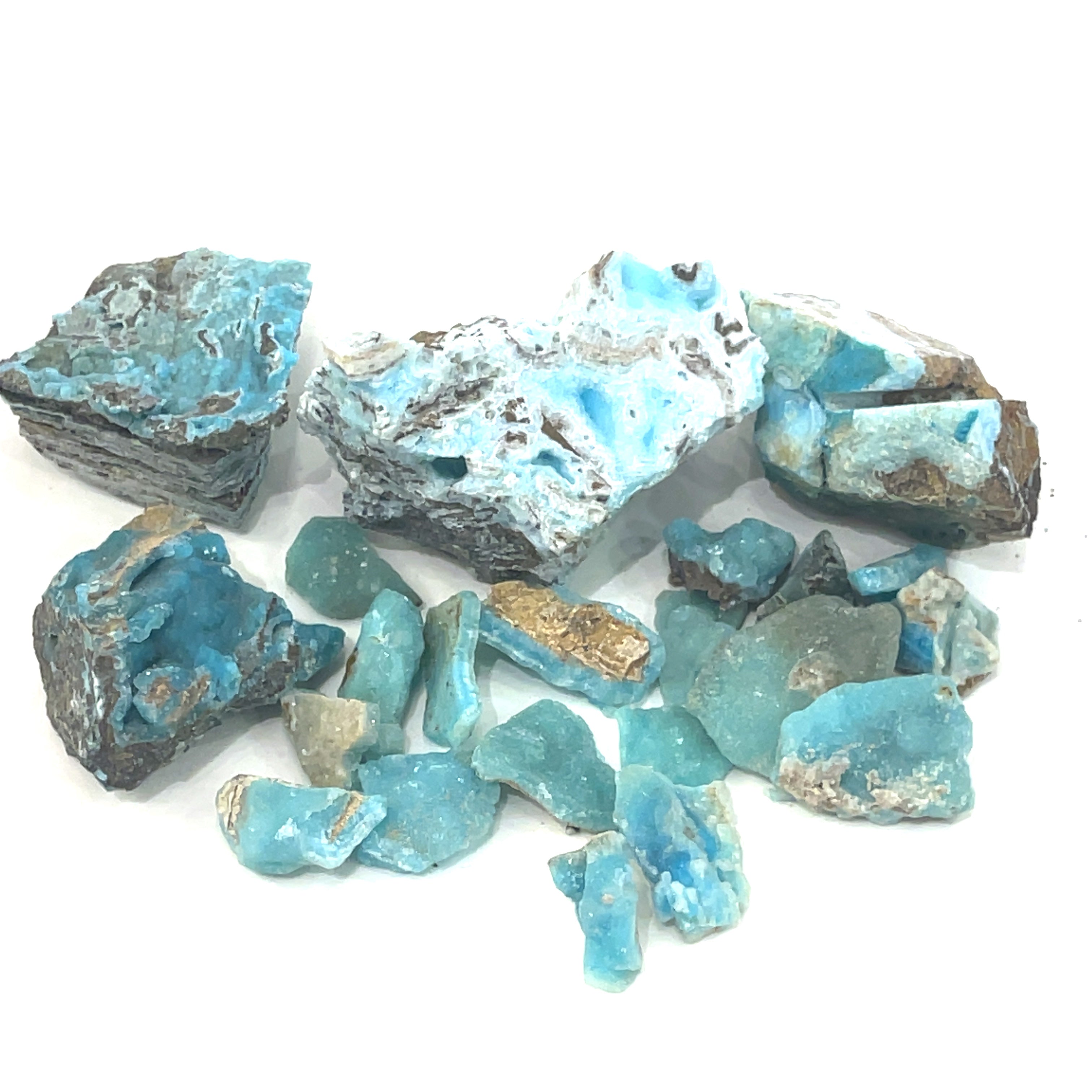 A large group of different sizes of raw Hemimorphite pieces on  a white background, front view. 