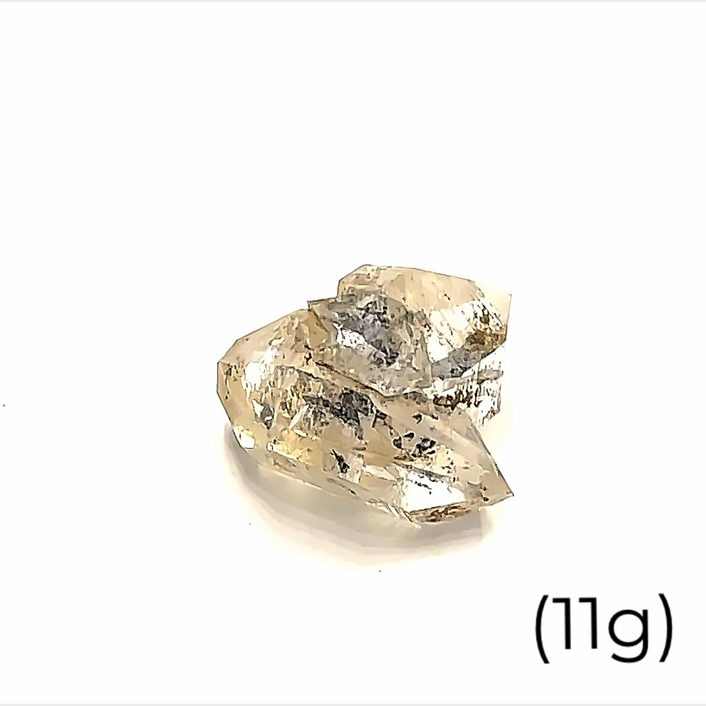 A  raw Herkimer diamond gemstone (11g) displayed on a white background, front, overview. 