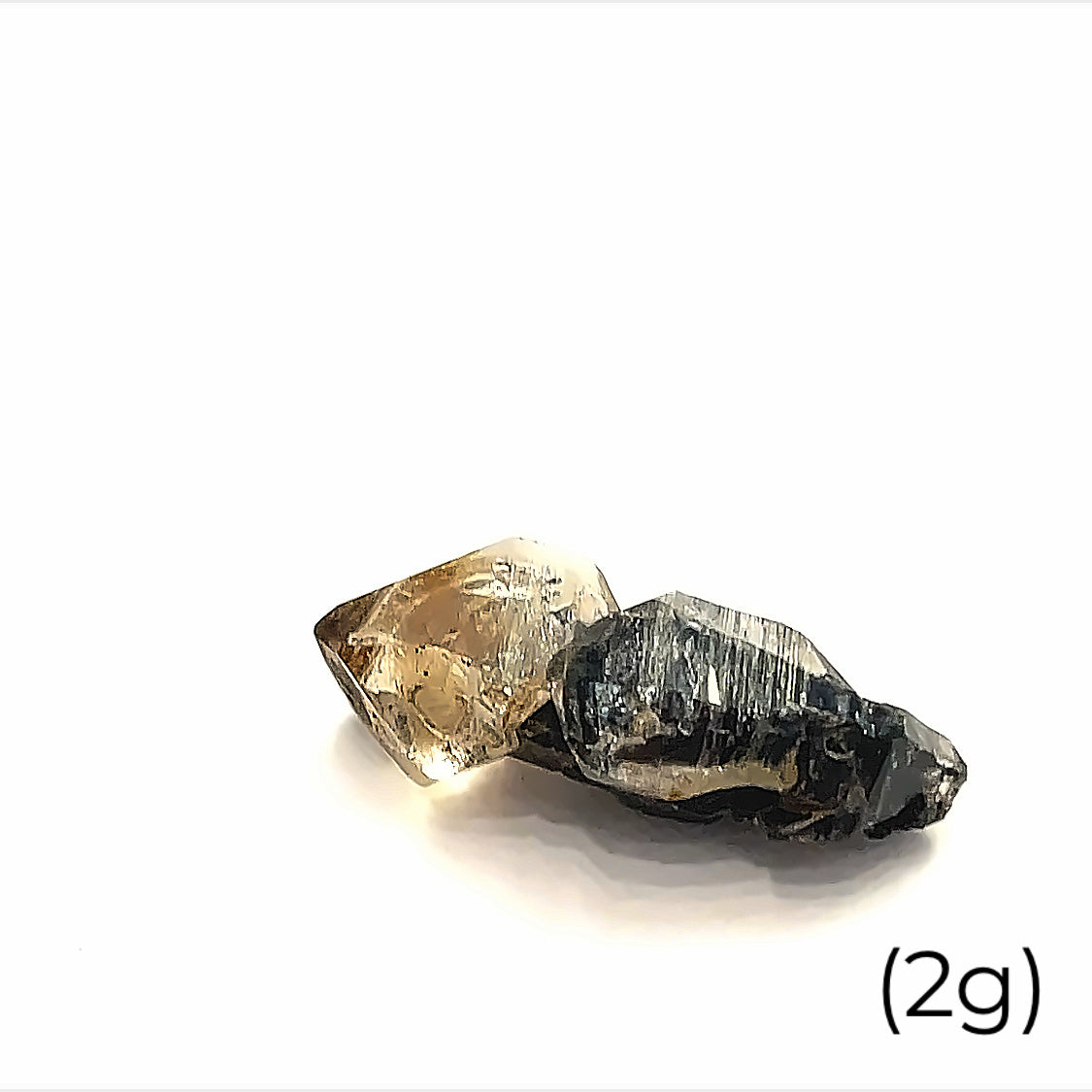 A raw Herkimer diamond gemstone (2g) displayed on a white background, front, overview. 