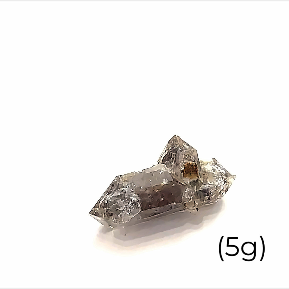 A  raw Herkimer diamond gemstone (5g) displayed on a white background, front, overview. 