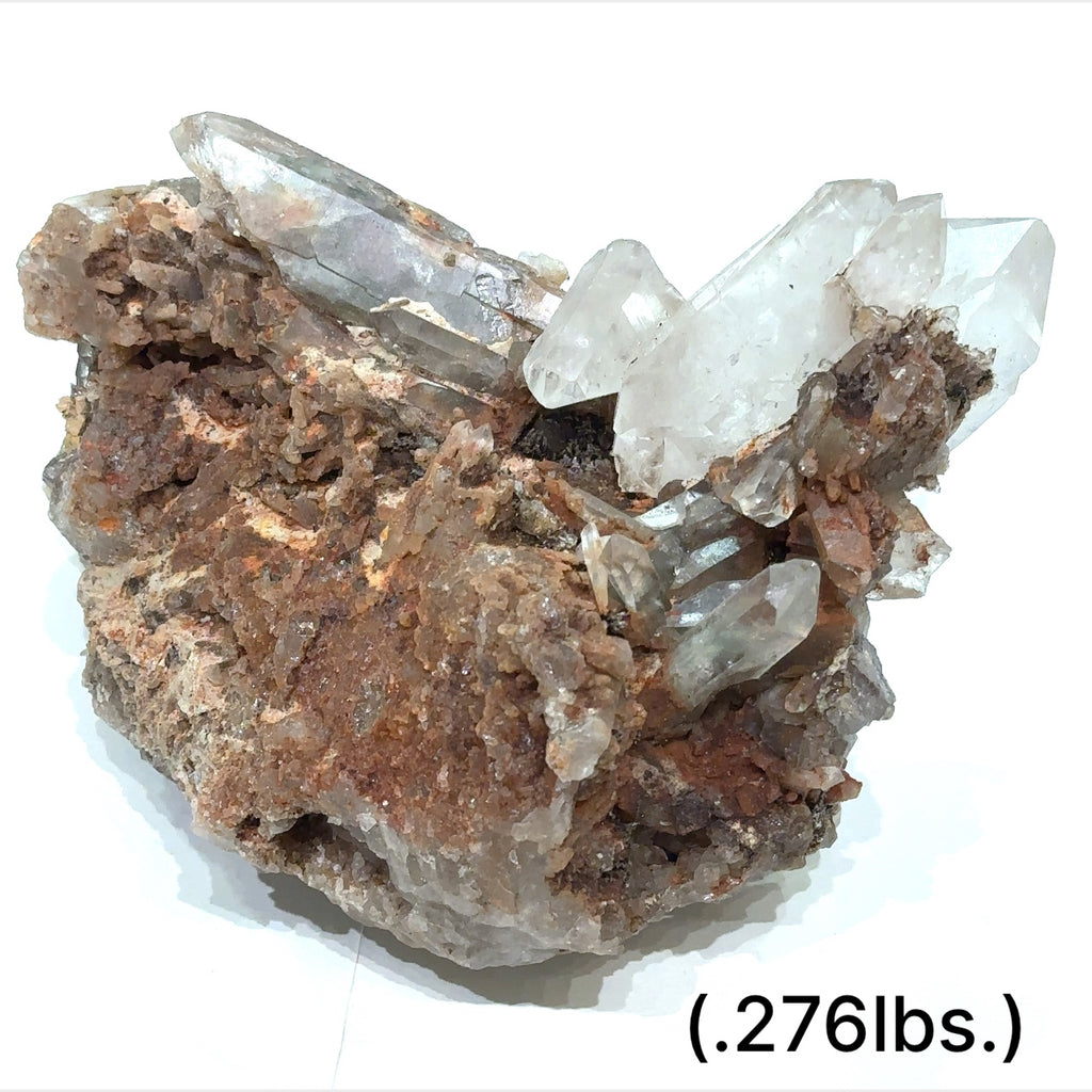 A raw Red Quartz gemstone cluster from Morocco with a rough, crystalline surface and a brownish-red color. The approximate weight range is indicated as .276lbs. on a white background, front view.